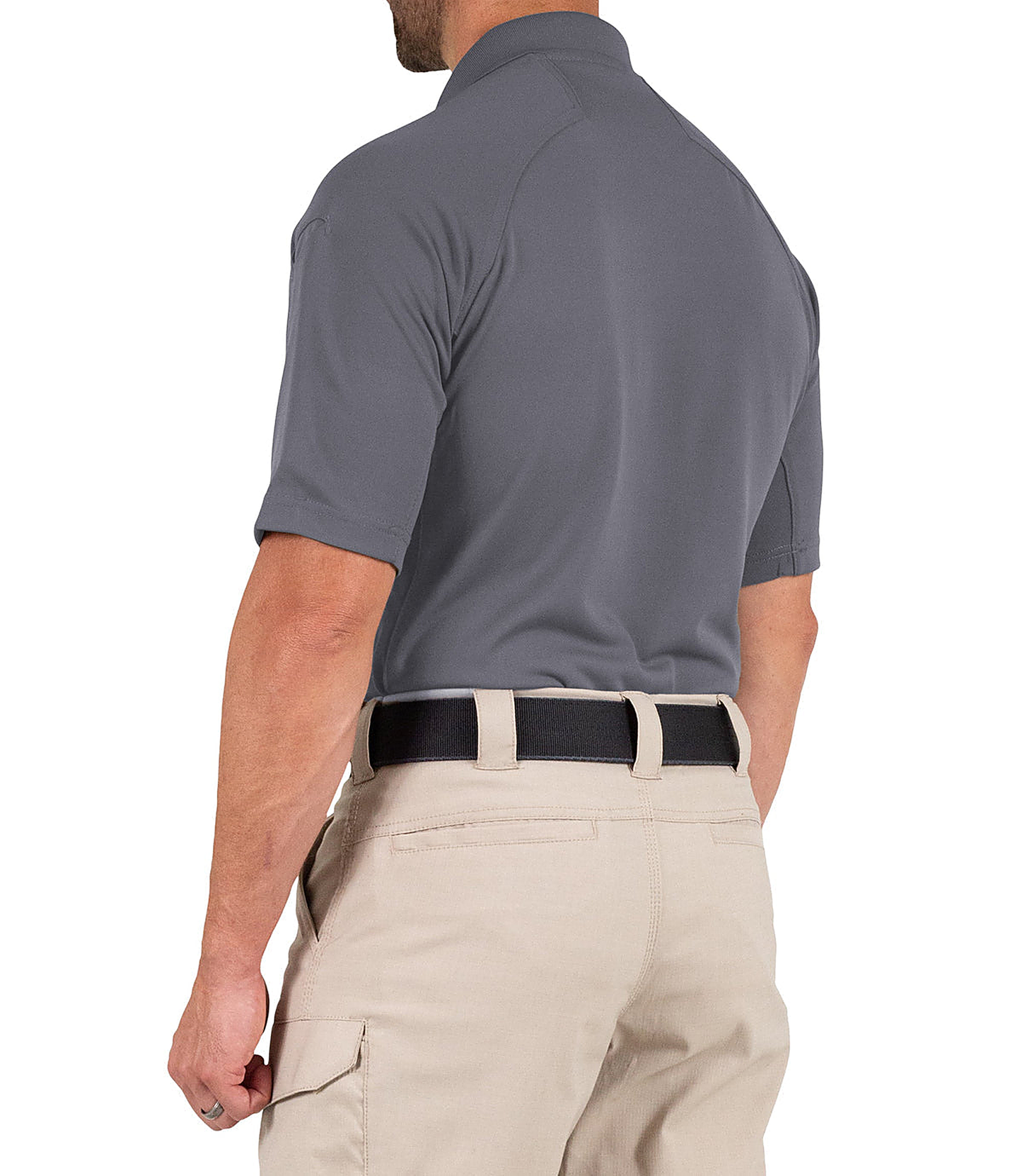 Man wearing a gray polo shirt and beige pants on a white background