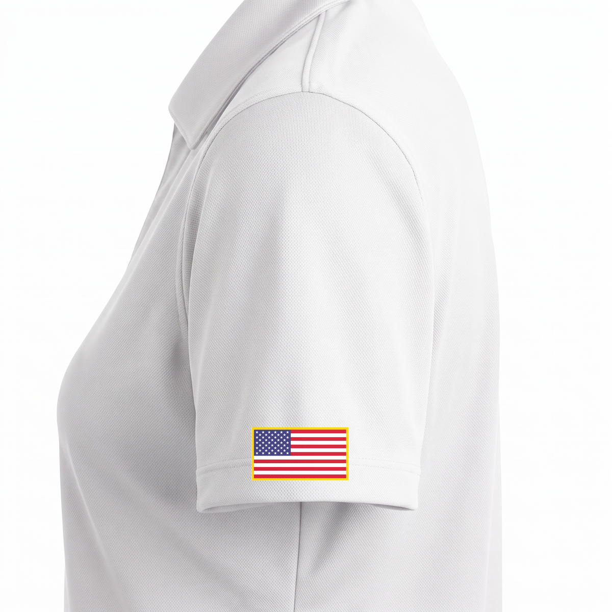 Siskiyou Trojans ladies Sport-Tek polo in white, close-up of the left sleeve showing the United States flag patch just above the sleeve hem