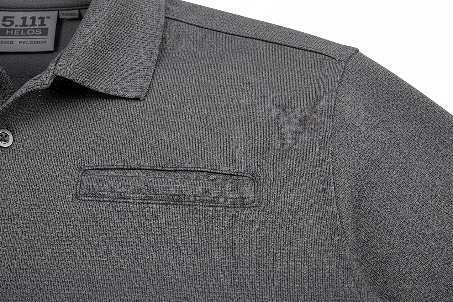 5.11 Tactical Polo Detail Shot - Moisture-Wicking Fabric Texture, Badge Tab, Pen Pocket Close-Up