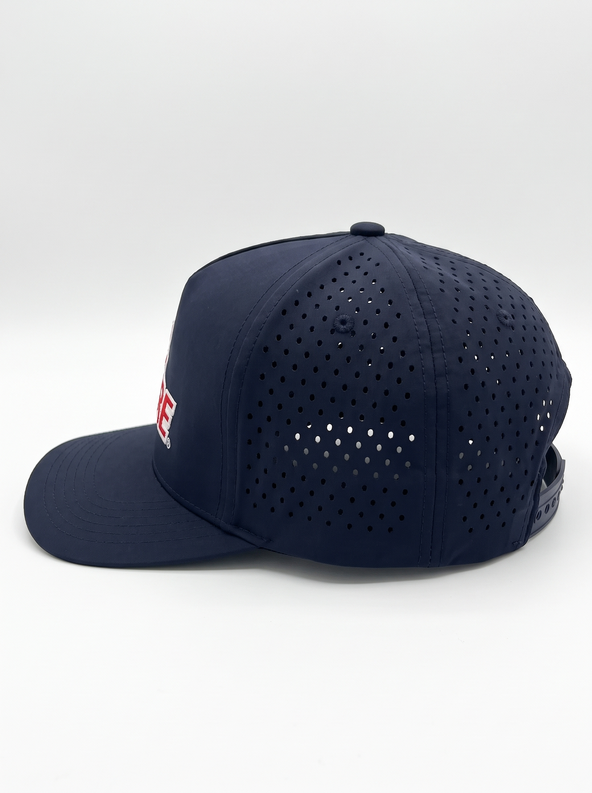 CAL FIRE 5-Panel Performance Hat, left side profile showing the laser-perforated vent panels, dark navy with red CAL FIRE wordmark with white outline (product render)