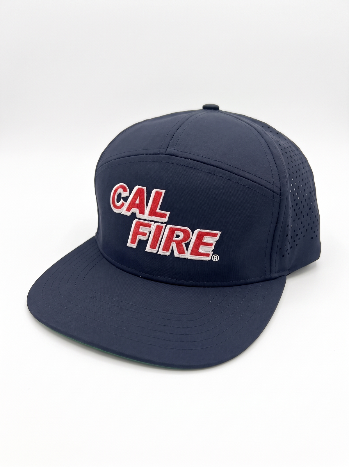 CAL FIRE 7-Panel Performance Hat, front three-quarter view, dark navy with red CAL FIRE wordmark with white outline (product render)