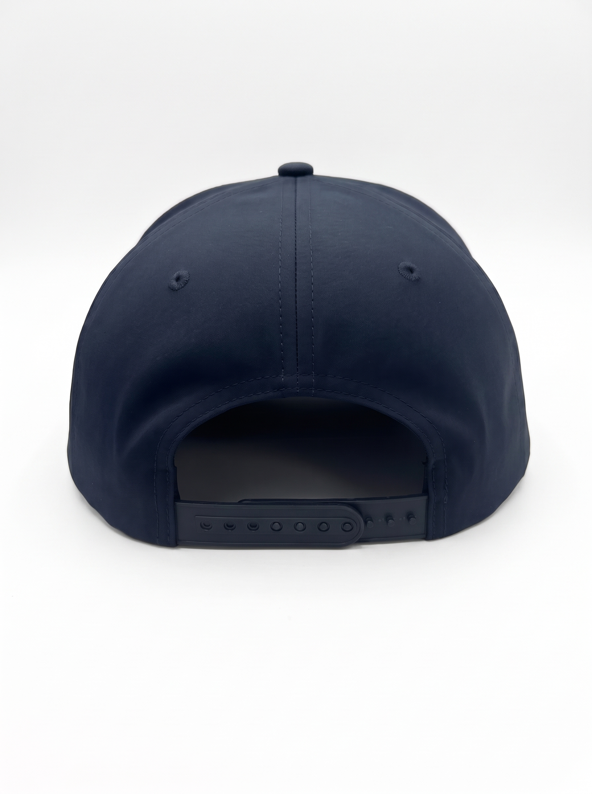 CAL FIRE 7-Panel Performance Hat, back view showing the perforated rear panels and snapback closure, dark navy with red CAL FIRE wordmark with white outline (product render)