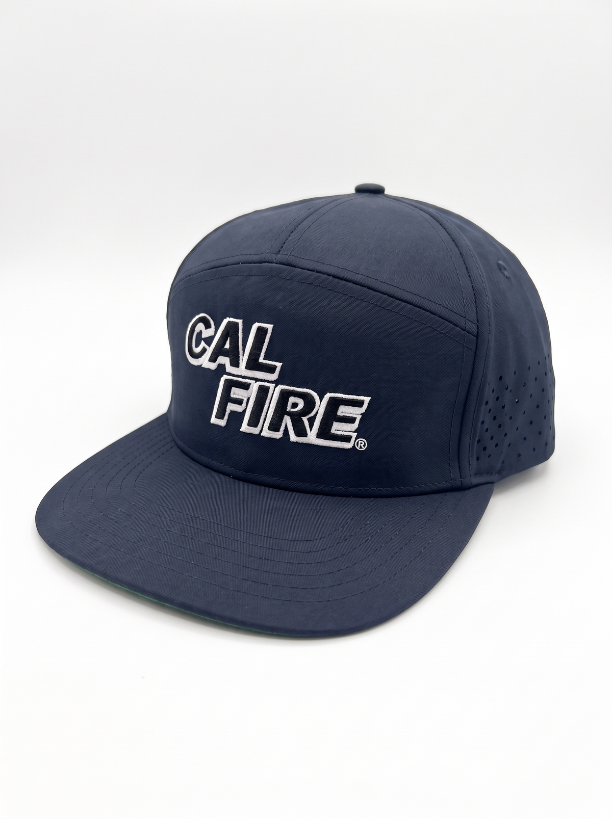CAL FIRE 7-Panel Performance Hat - White Text, front three-quarter view, dark navy with white-outline CAL FIRE wordmark (product render)