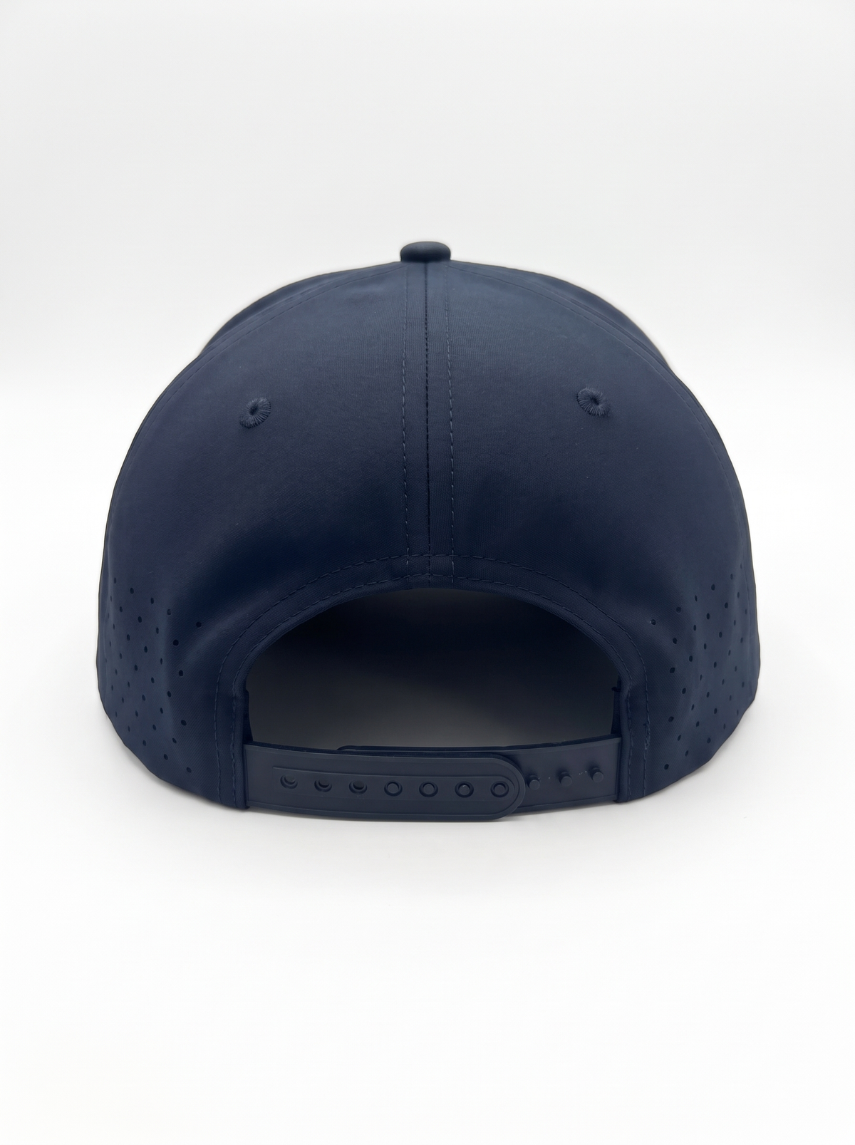 CAL FIRE 7-Panel Performance Hat - White Text, back view showing the perforated rear panels and snapback closure, dark navy with white-only CAL FIRE wordmark (product render)
