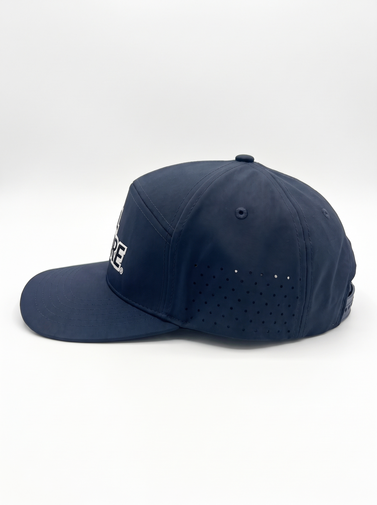 CAL FIRE 7-Panel Performance Hat - White Text, left side profile showing the laser-perforated vent panels, dark navy with white-outline CAL FIRE wordmark (product render)