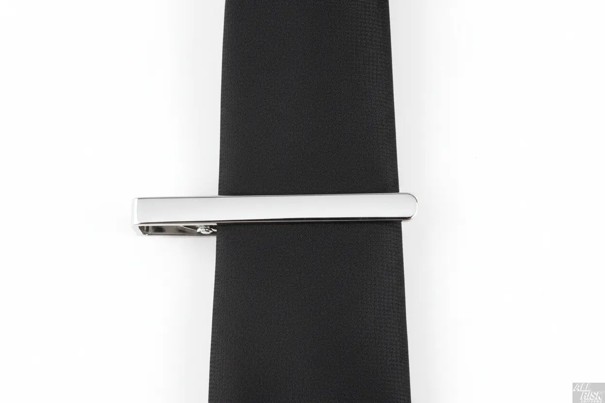 Blackinton Silver Tie Bar in Use - CAL FIRE Official Tie Clip Securing Black Uniform Tie - American Made Class A Dress Uniform Accessory - Functional Product Photography
