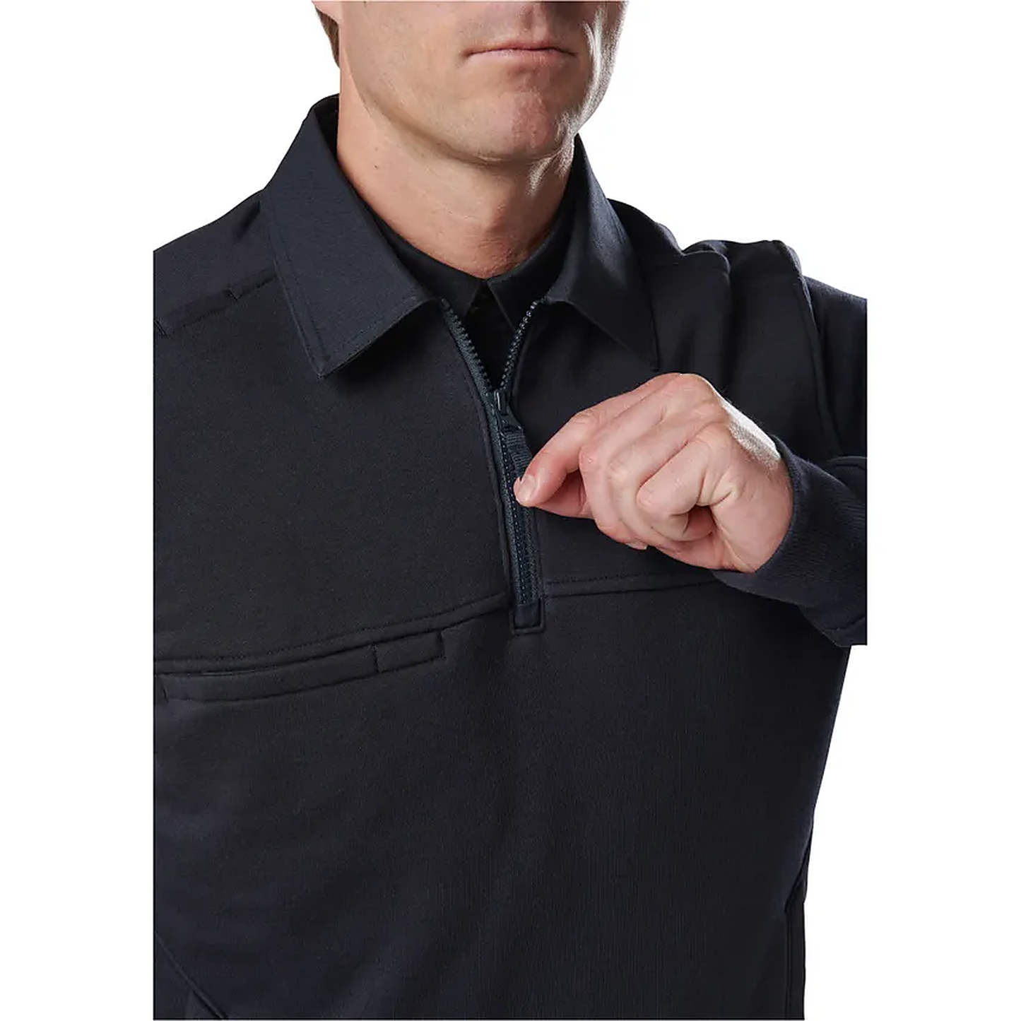 Front detail of a model zipping the quarter-zip placket of the navy job shirt near the chest.