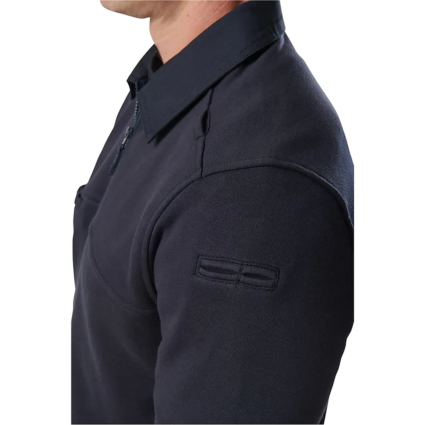 Detail shot of the navy job shirt's shoulder and collar on a model, highlighting the reinforced shoulder panel and tonal stitching.