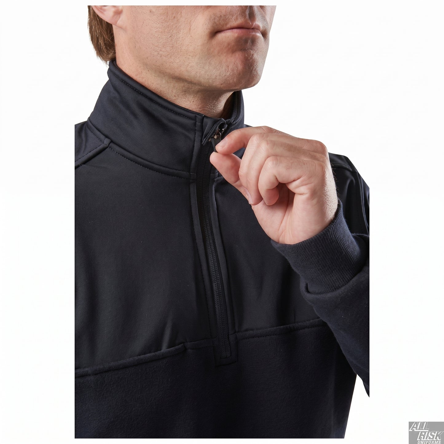 Model pinching the quarter-zip pull at the chest, close-up of the zip placket and stand collar on the navy job shirt.