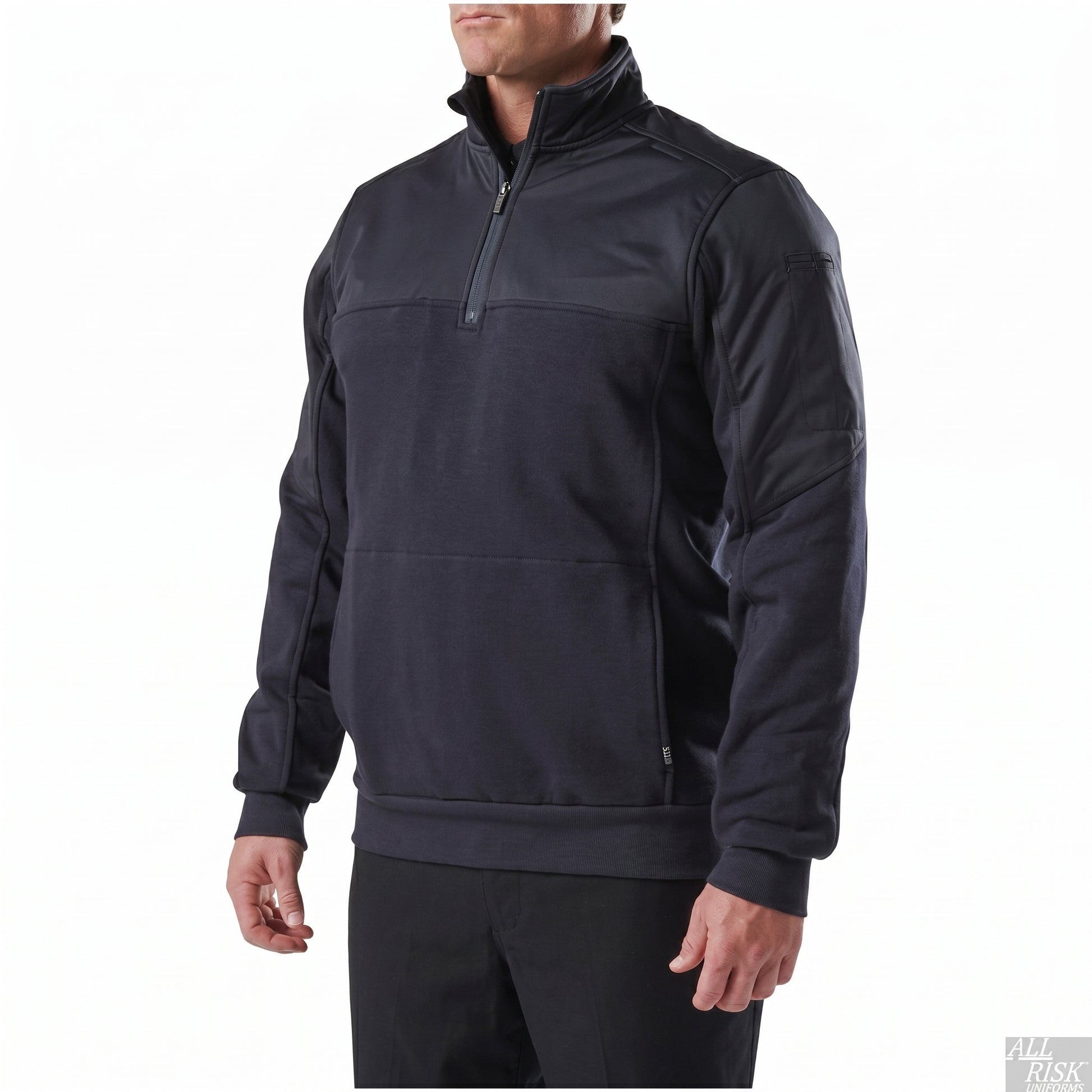 Three-quarter front view of the plain navy job shirt highlighting the half-zip placket, shoulder yoke and a low-profile zippered sleeve pocket.