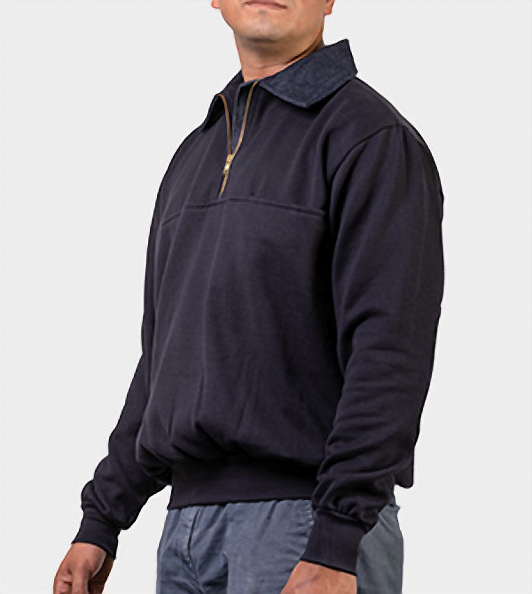 Male model in the navy job shirt, front three-quarter view showing the denim collar and gold quarter-zip with the logo side turned away.