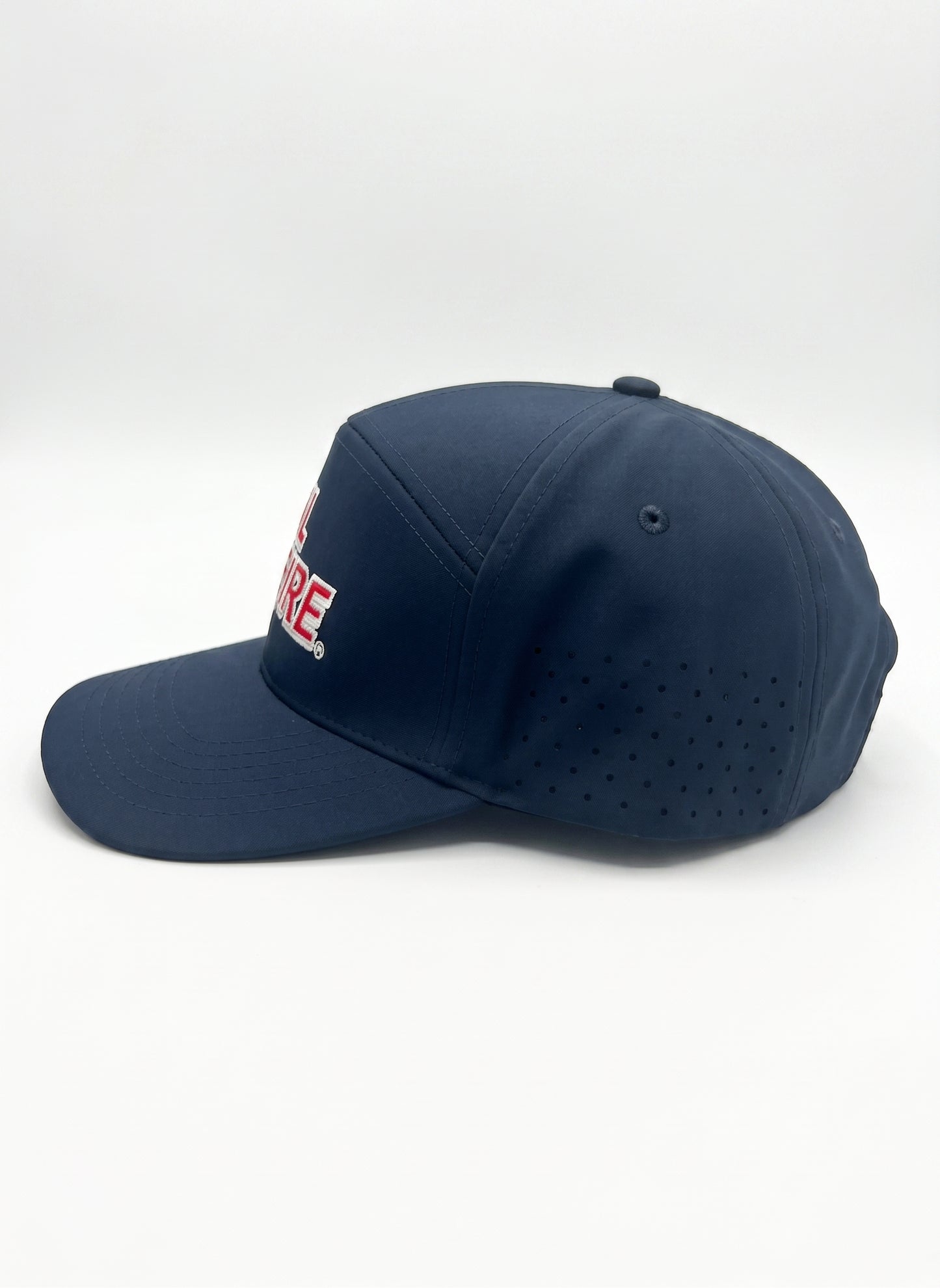 Midnight navy CAL FIRE laser-vented athletic cap, right side profile showing the laser-perforated vent panels and flat brim.