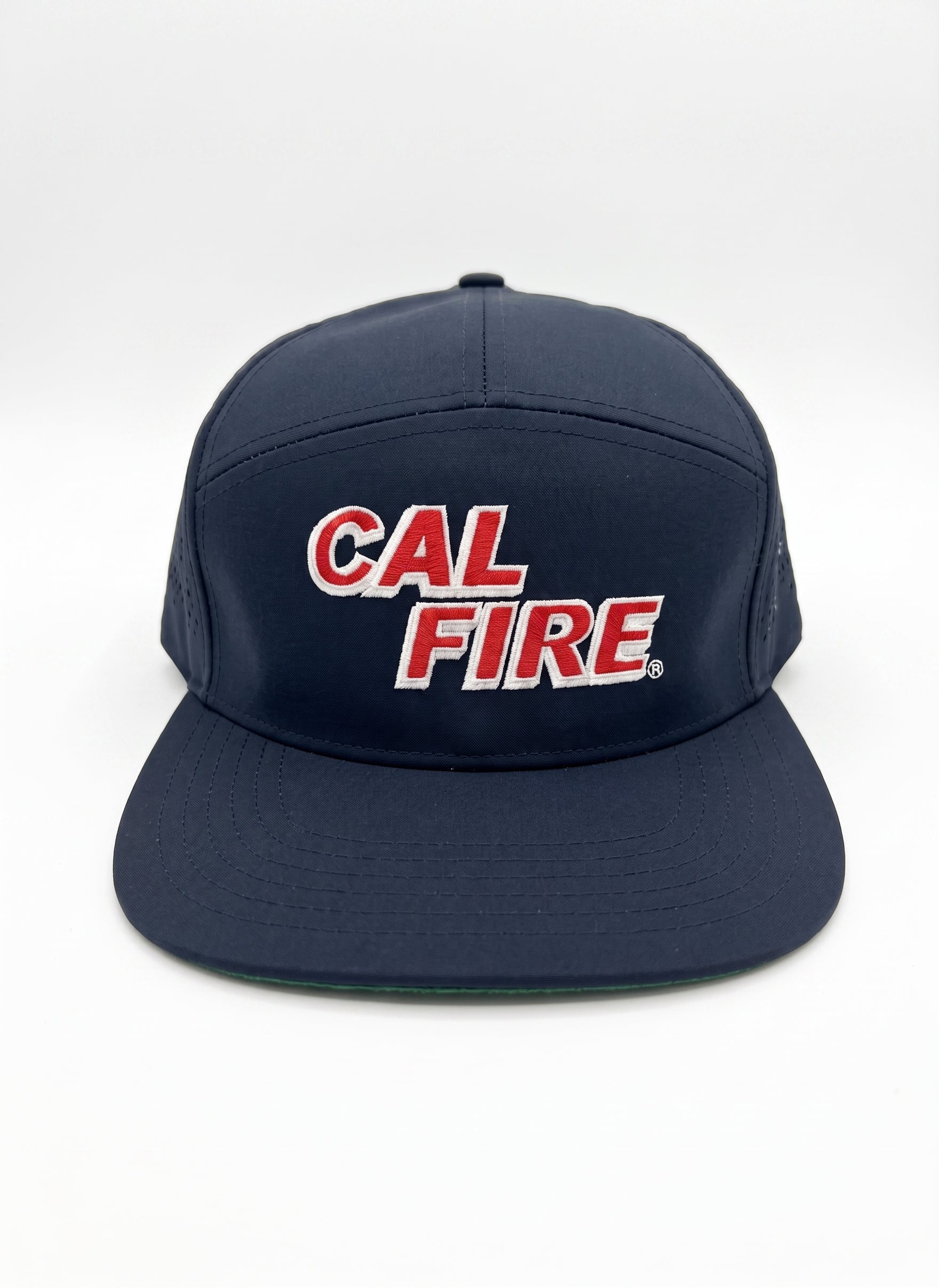 Midnight navy CAL FIRE laser-vented 7-panel athletic cap, front view with the red CAL FIRE italic wordmark (white outline) on the crown and a flat brim.