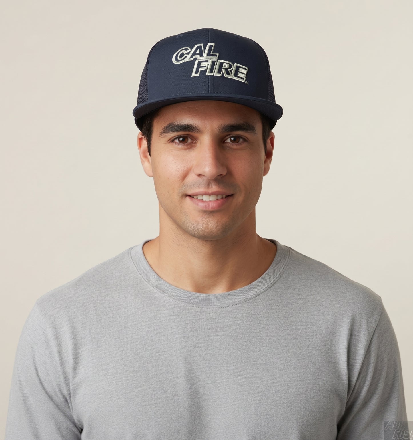 Man in a gray t-shirt wearing the midnight navy CAL FIRE New Era 403 snapback with the red wordmark.