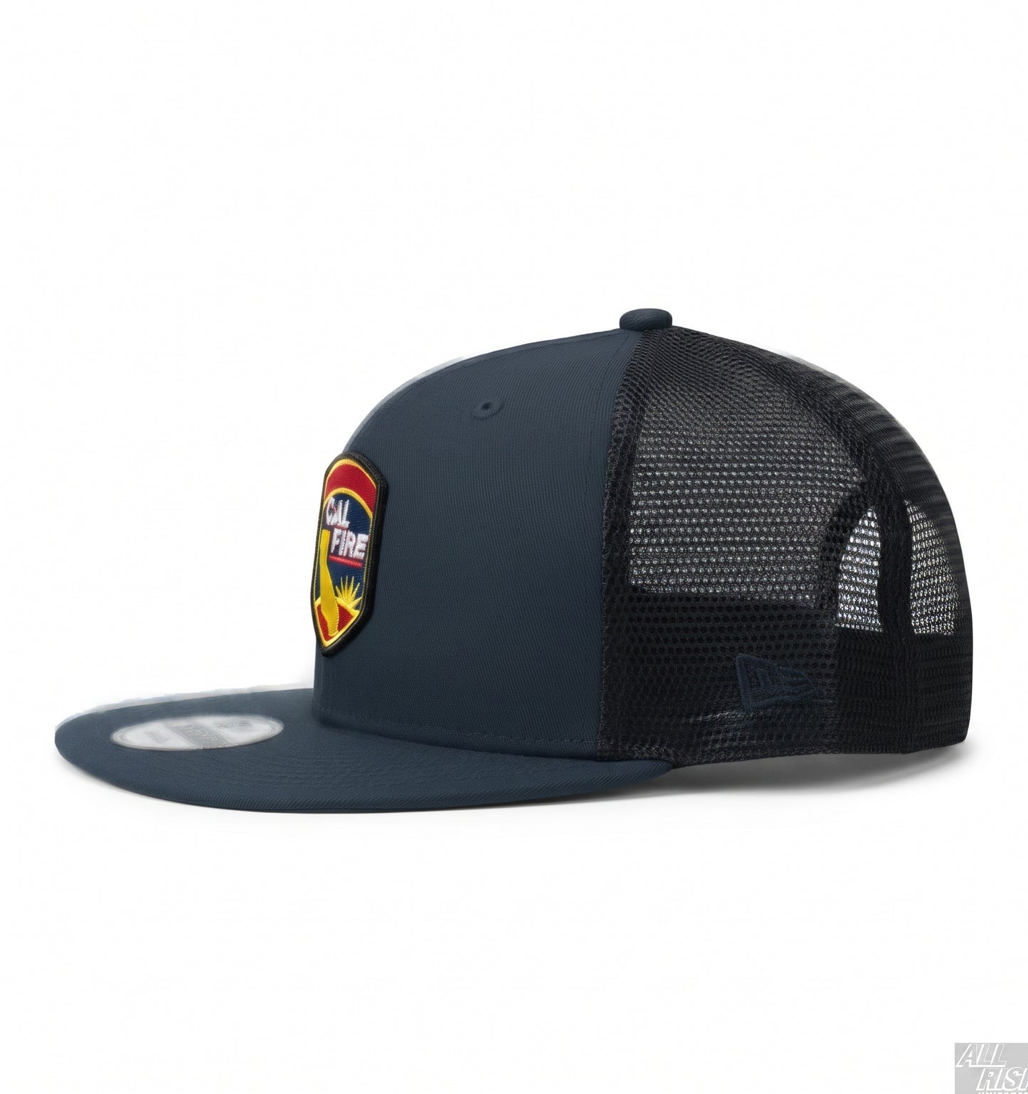 Navy New Era 403 trucker snapback, left side profile, showing the colorful CAL FIRE shield crest, black mesh back and the New Era flag on the brim.