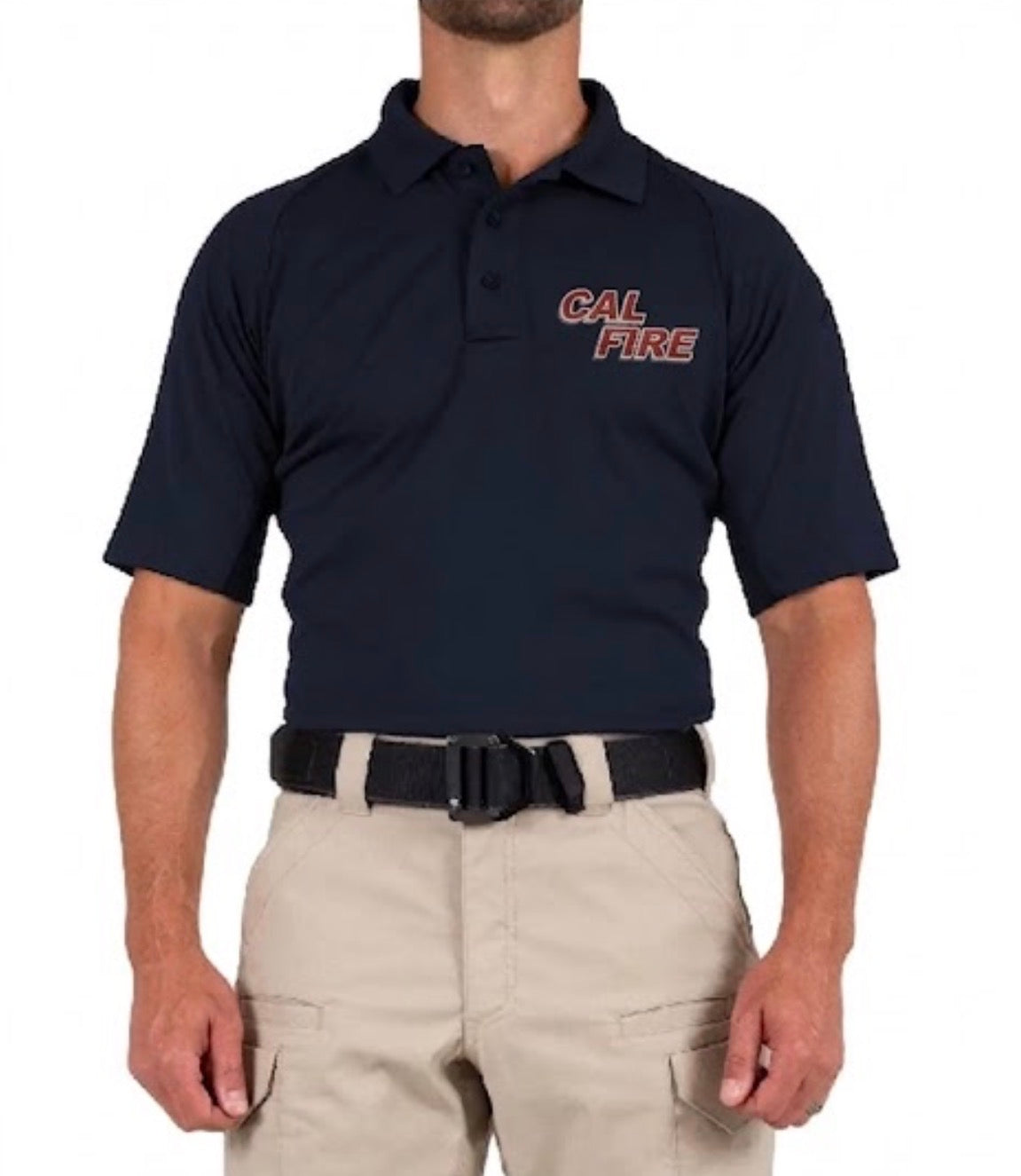 Straight-on front view of a model wearing the navy polo with a red stacked CAL FIRE chest wordmark, khaki pants, and a black belt.
