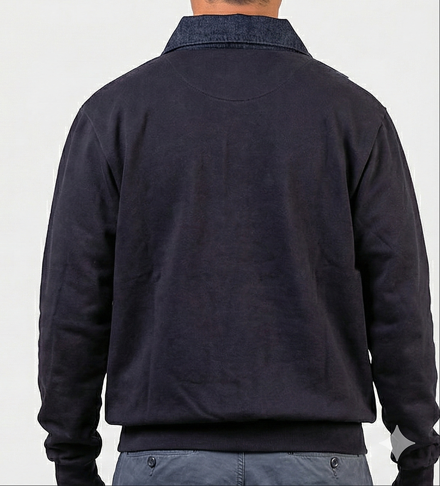 Back view on a model of the navy job shirt showing the plain unprinted back and the denim collar from behind.