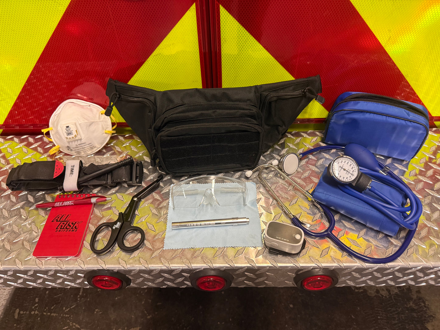 EMS  supplies stethoscope, blood pressure cuff, trauma shears, N95, KN95, Tourniquet, pulse ox, pulse oximeter, pen light, fanny pack, student, safety glasses