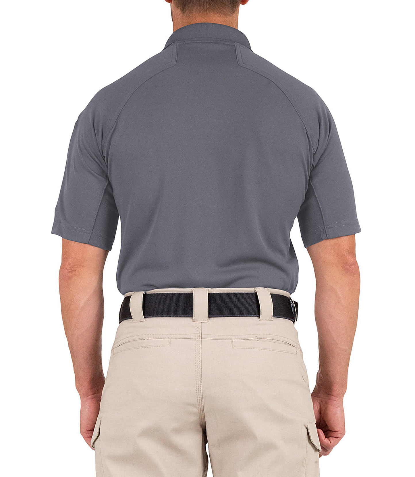 Man wearing a gray polo shirt and beige pants on a white background
