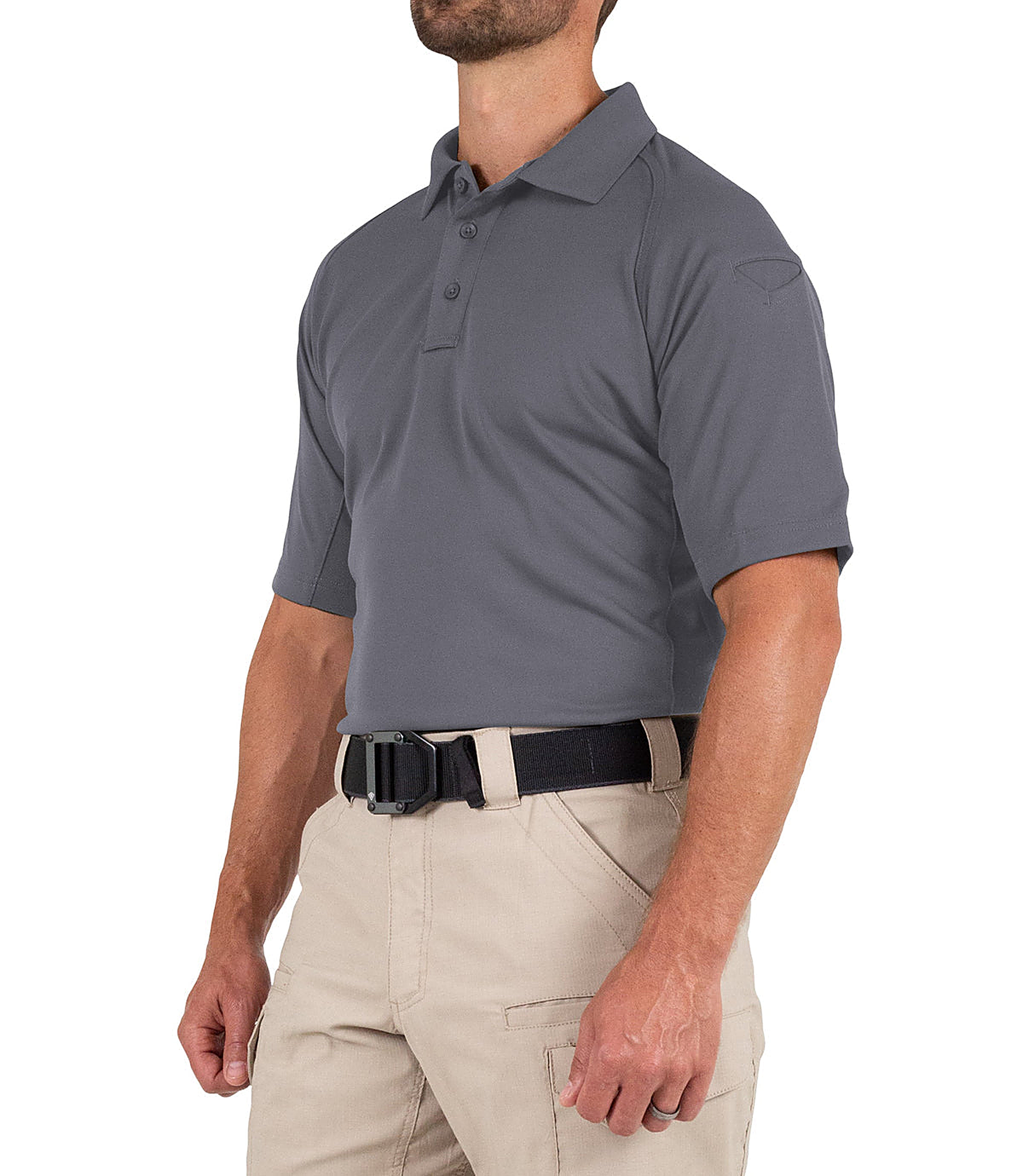Man wearing a gray polo shirt and beige pants on a white background
