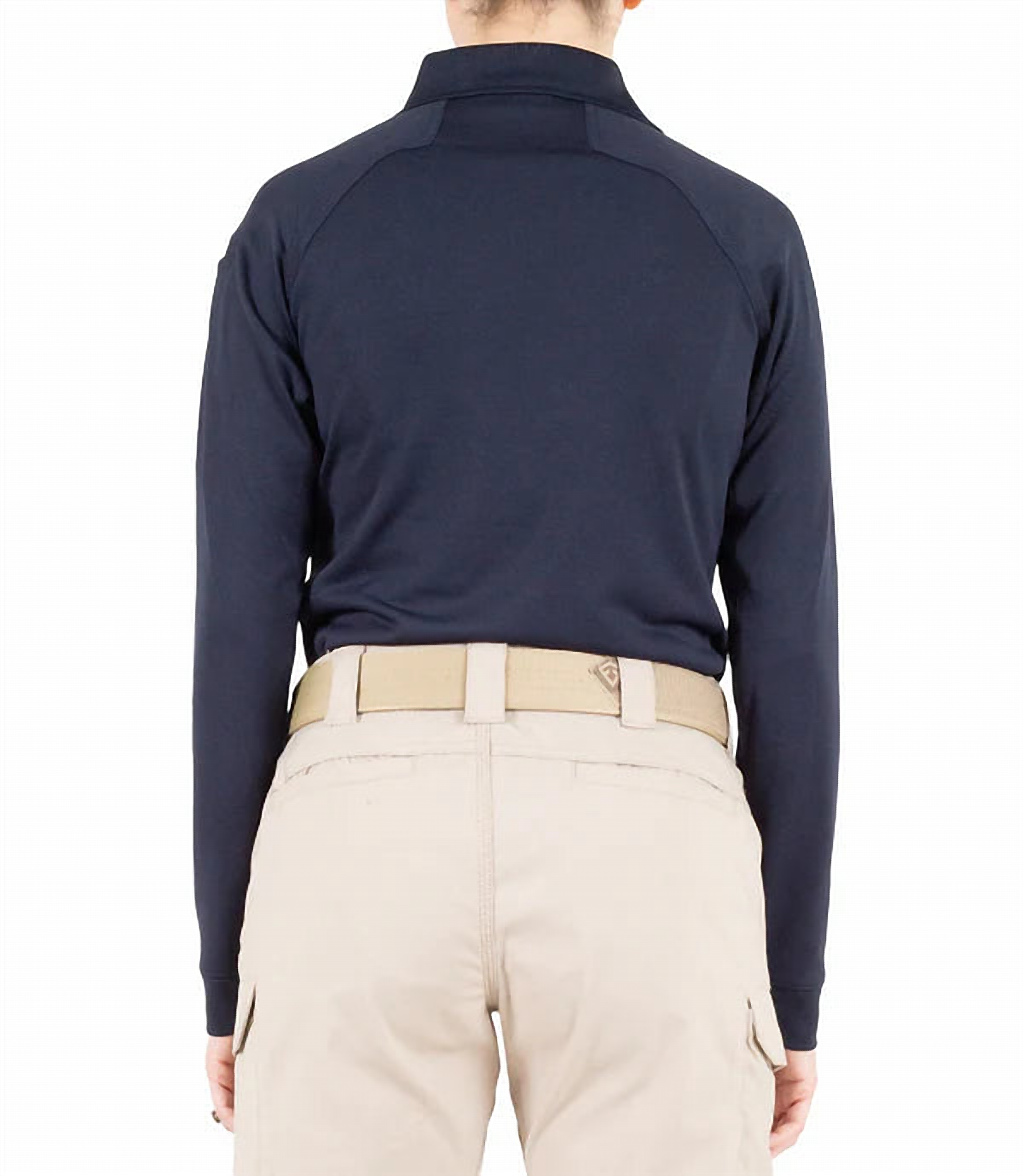 Straight back view of a model in the plain navy long-sleeve polo paired with khaki pants and a tan belt.