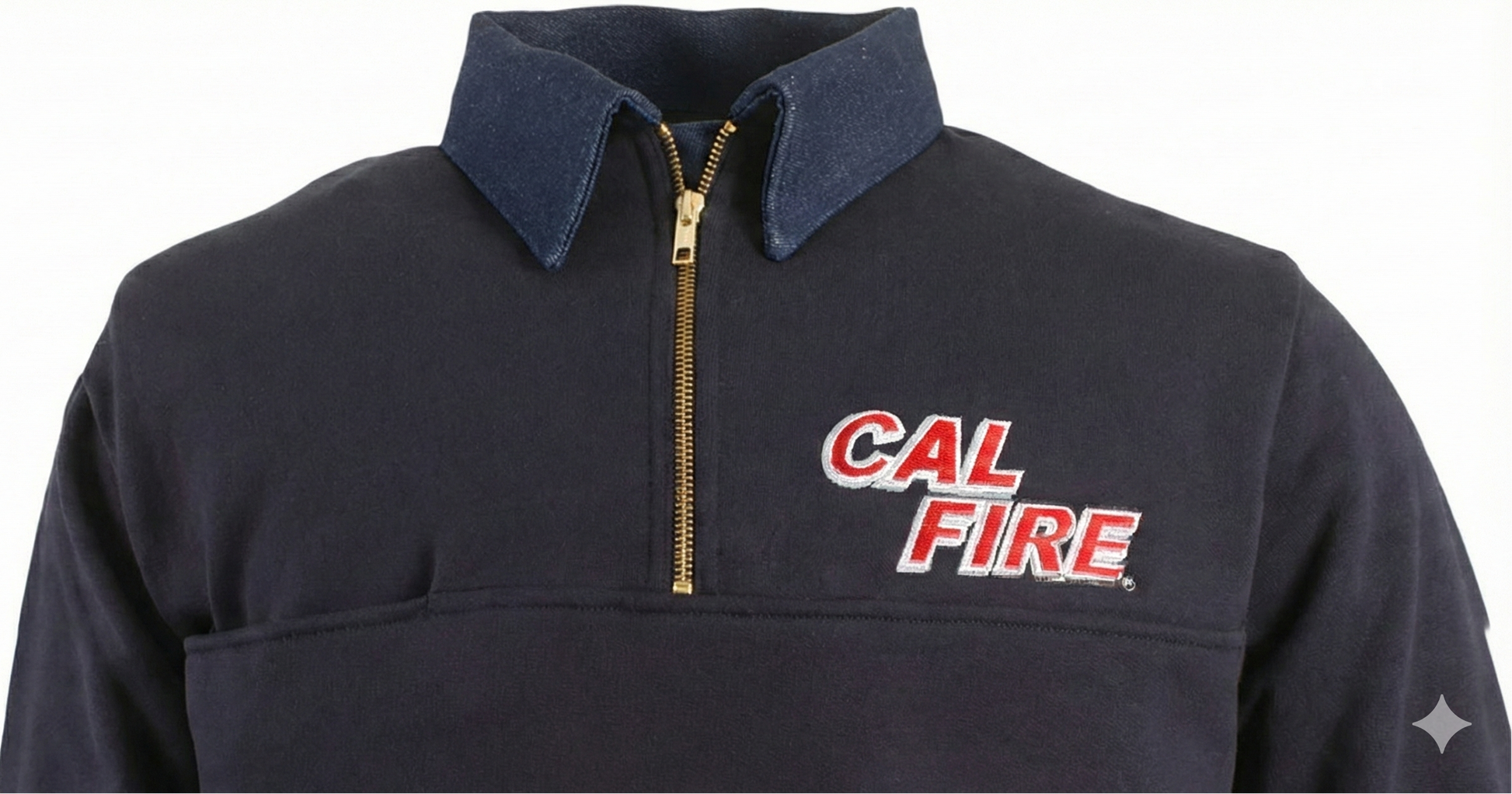 Three-quarter chest close-up showing the red CAL FIRE italic wordmark beneath the denim collar and gold zipper.