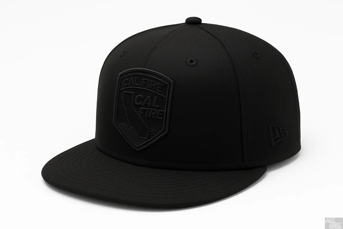 All-black New Era flat-bill snapback, three-quarter view, with a tonal black-on-black CAL FIRE shield crest on the crown and the black New Era flag on the side.