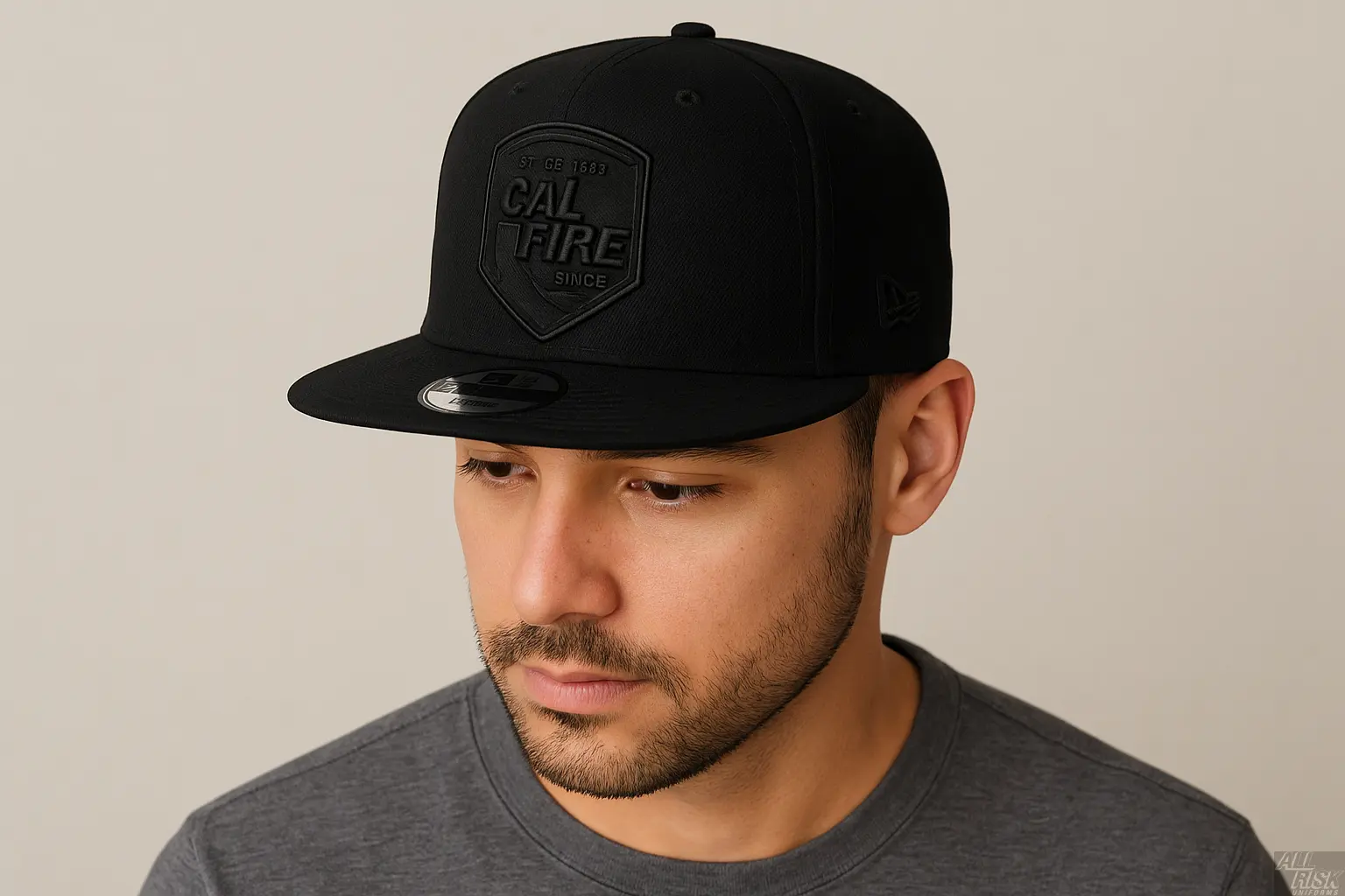 Person wearing New Era 403 Snapback Hat in solid black with blacked-out CAL FIRE shield logo showing comfortable fit and flat bill style