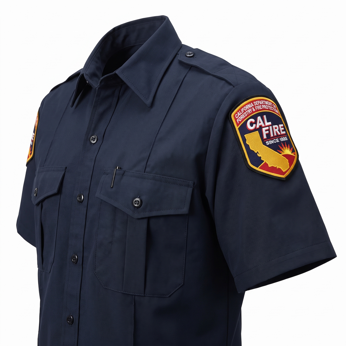 Angled detail of the CAL FIRE Mens Flying Cross Short Sleeve Nomex shirt showing the epaulet, shoulder patch and left chest pocket with pencil stall