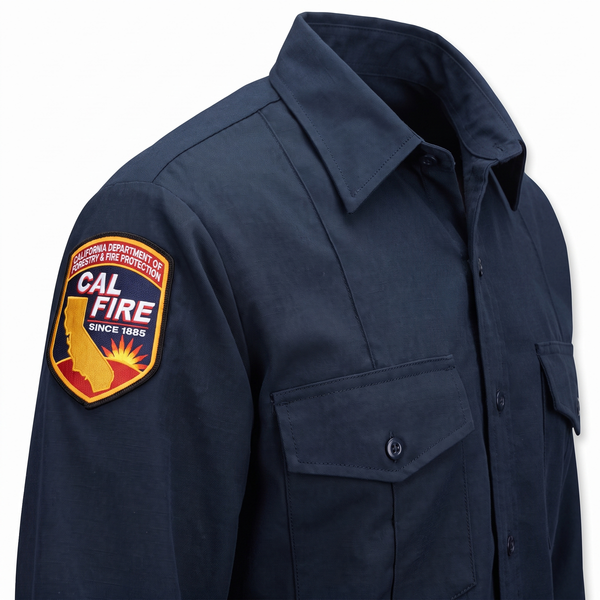 Angled detail of the CAL FIRE Mens WorkRite Long Sleeve Nomex shirt showing the shoulder patch, collar and left chest pocket