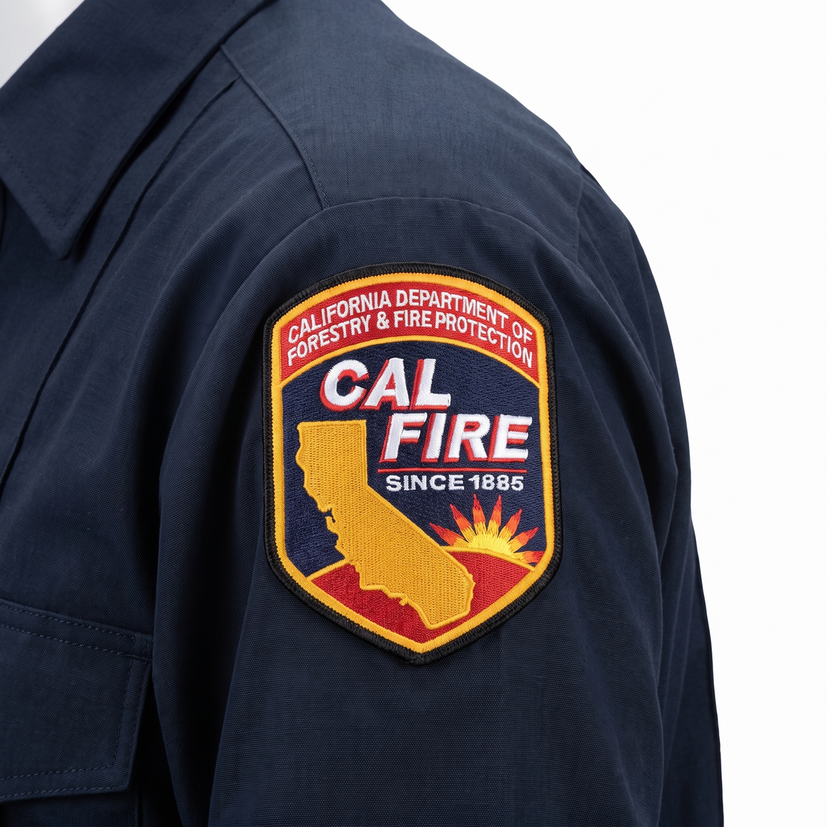 Close-up of the embroidered CAL FIRE shoulder patch on the sleeve of the Mens WorkRite Long Sleeve Nomex shirt
