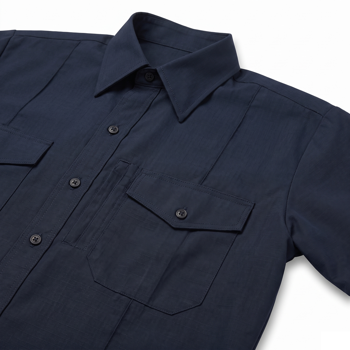 Collar and left chest pocket detail of the CAL FIRE Mens WorkRite Short Sleeve Nomex shirt showing the scalloped flap and pencil stall