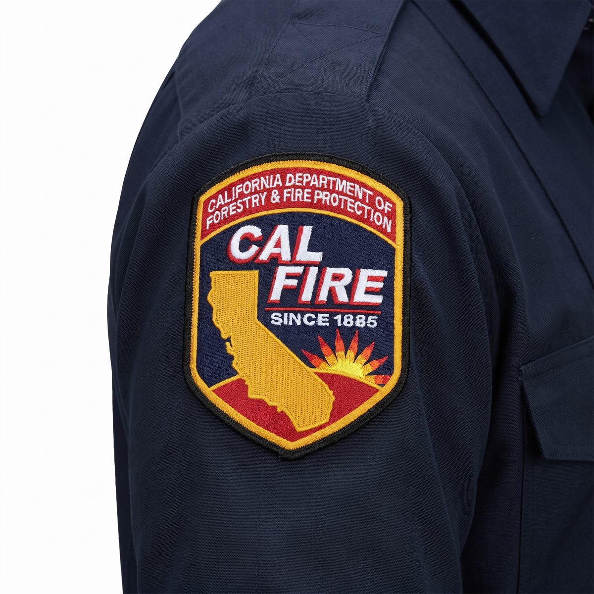 Close-up of the embroidered CAL FIRE shoulder patch on the sleeve of the Mens WorkRite Short Sleeve Nomex shirt
