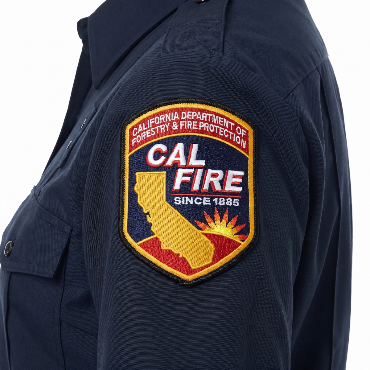 Close-up of the embroidered CAL FIRE shoulder patch on the sleeve of the Womens WorkRite Short Sleeve Nomex shirt