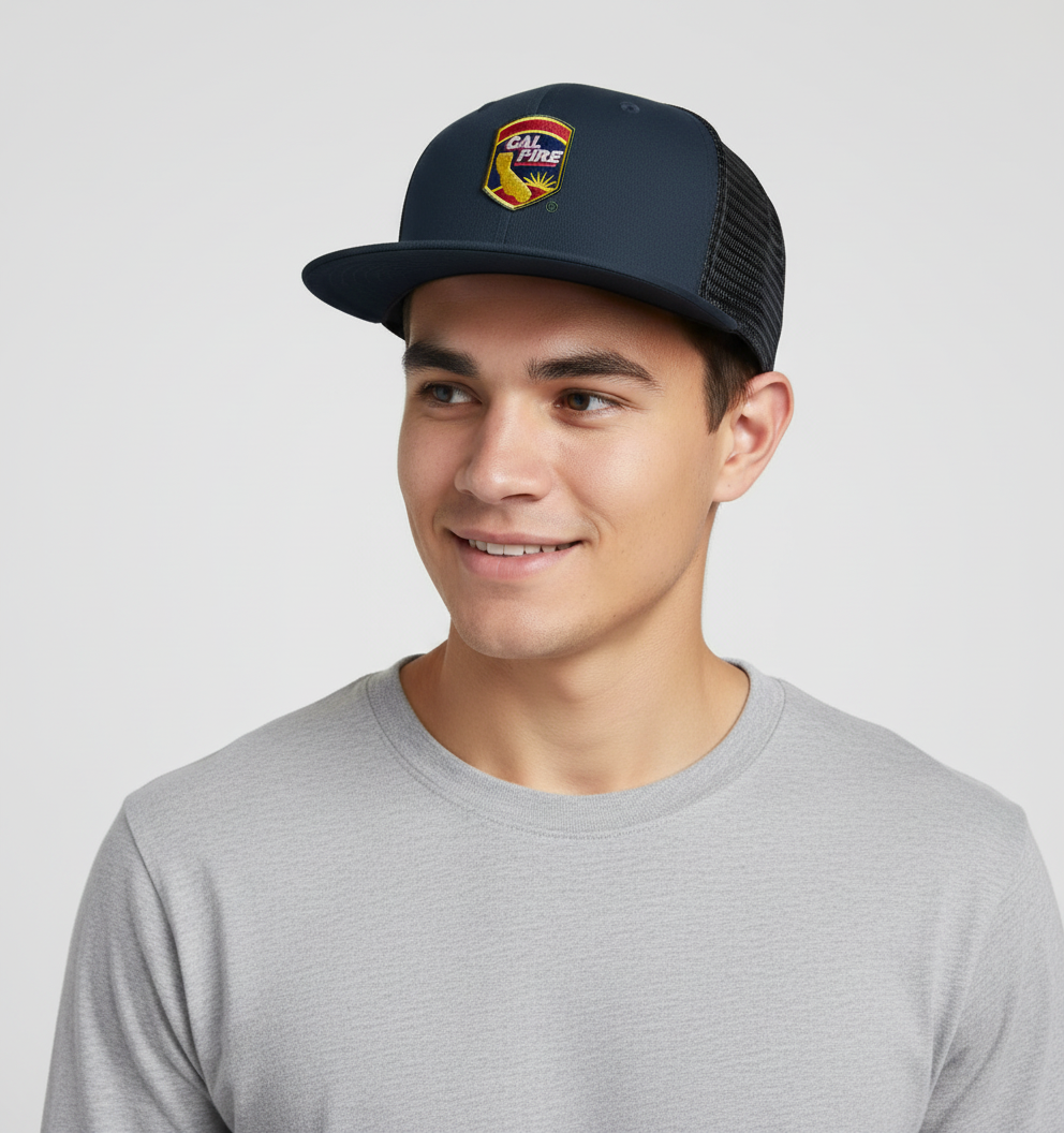 Person wearing New Era 403 Snapback Hat in midnight navy with CAL FIRE shield logo showing comfortable fit and flat bill style