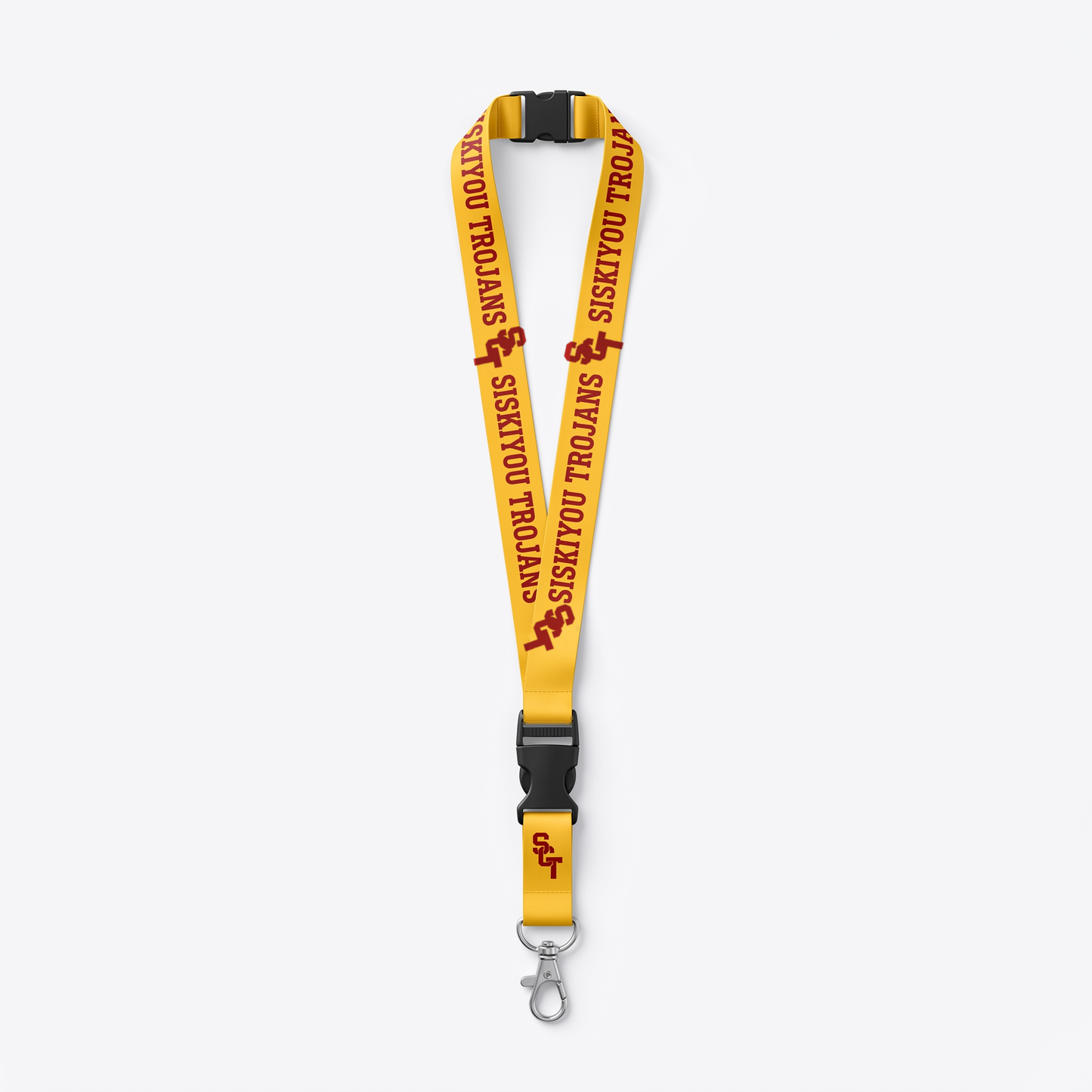 Siskiyou Trojans reversible lanyard, gold side showing cardinal SCT monogram and SISKIYOU TROJANS wordmark, with detachable buckle and lobster-claw clasp