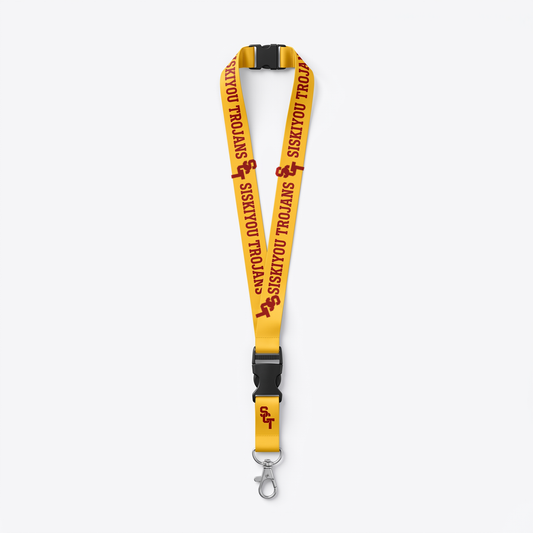 Siskiyou Trojans reversible lanyard, gold side showing cardinal SCT monogram and SISKIYOU TROJANS wordmark, with detachable buckle and lobster-claw clasp