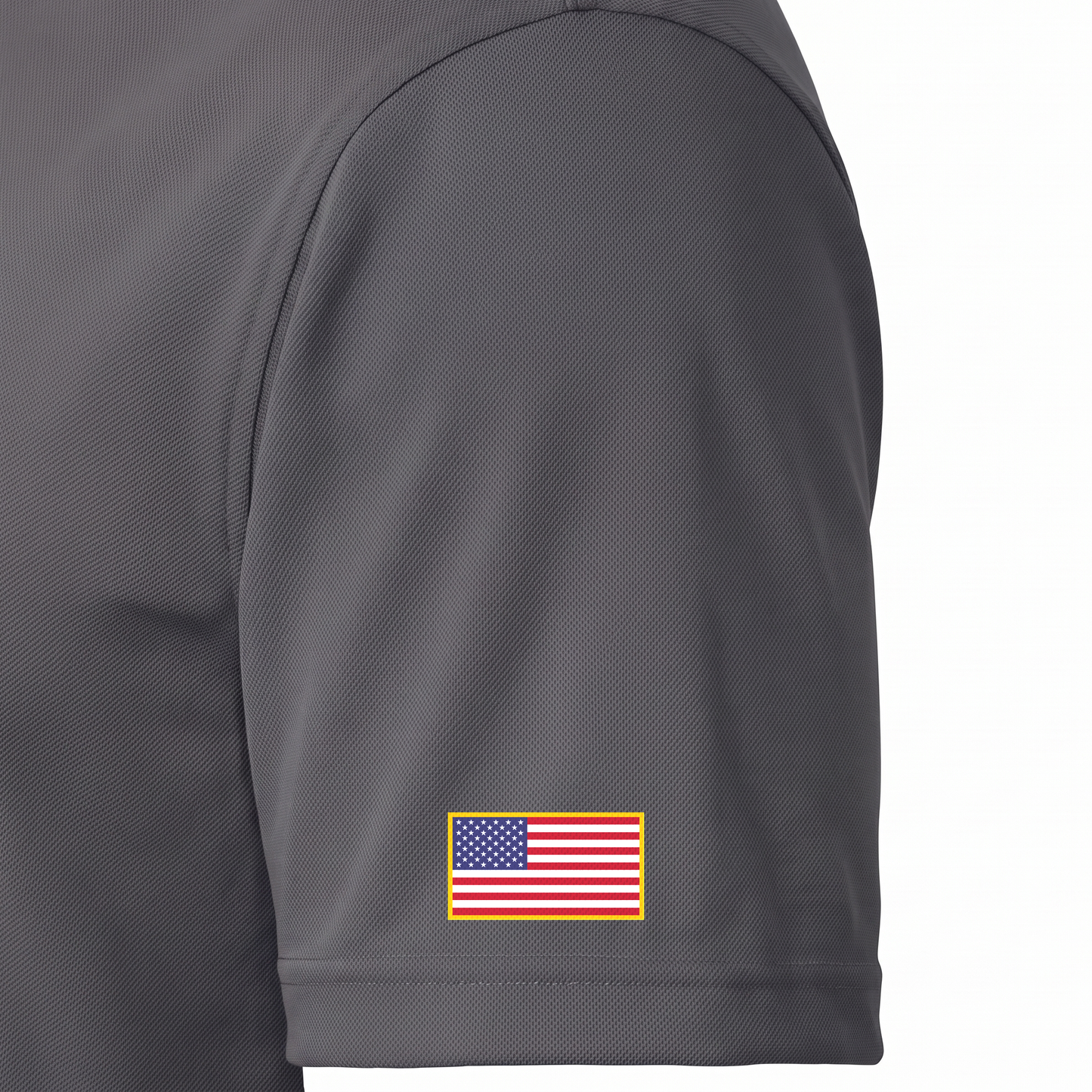 Siskiyou Trojans ladies Sport-Tek polo in iron grey, close-up of the left sleeve showing the United States flag patch just above the sleeve hem