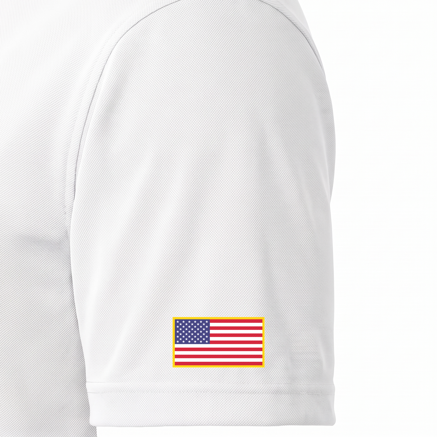 Siskiyou Trojans ladies Sport-Tek polo in white, close-up of the left sleeve showing the United States flag patch just above the sleeve hem