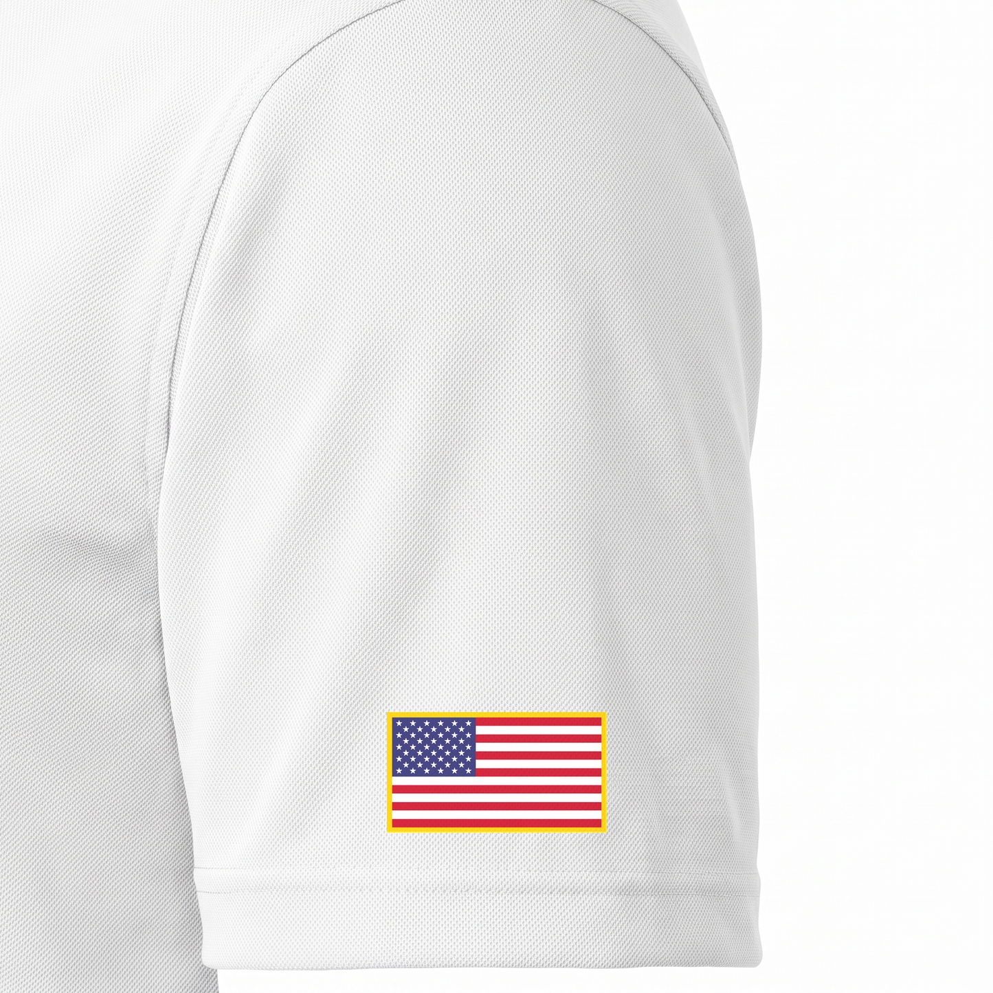 Siskiyou Trojans men's Sport-Tek polo in white, close-up of the left sleeve showing the United States flag patch just above the sleeve hem