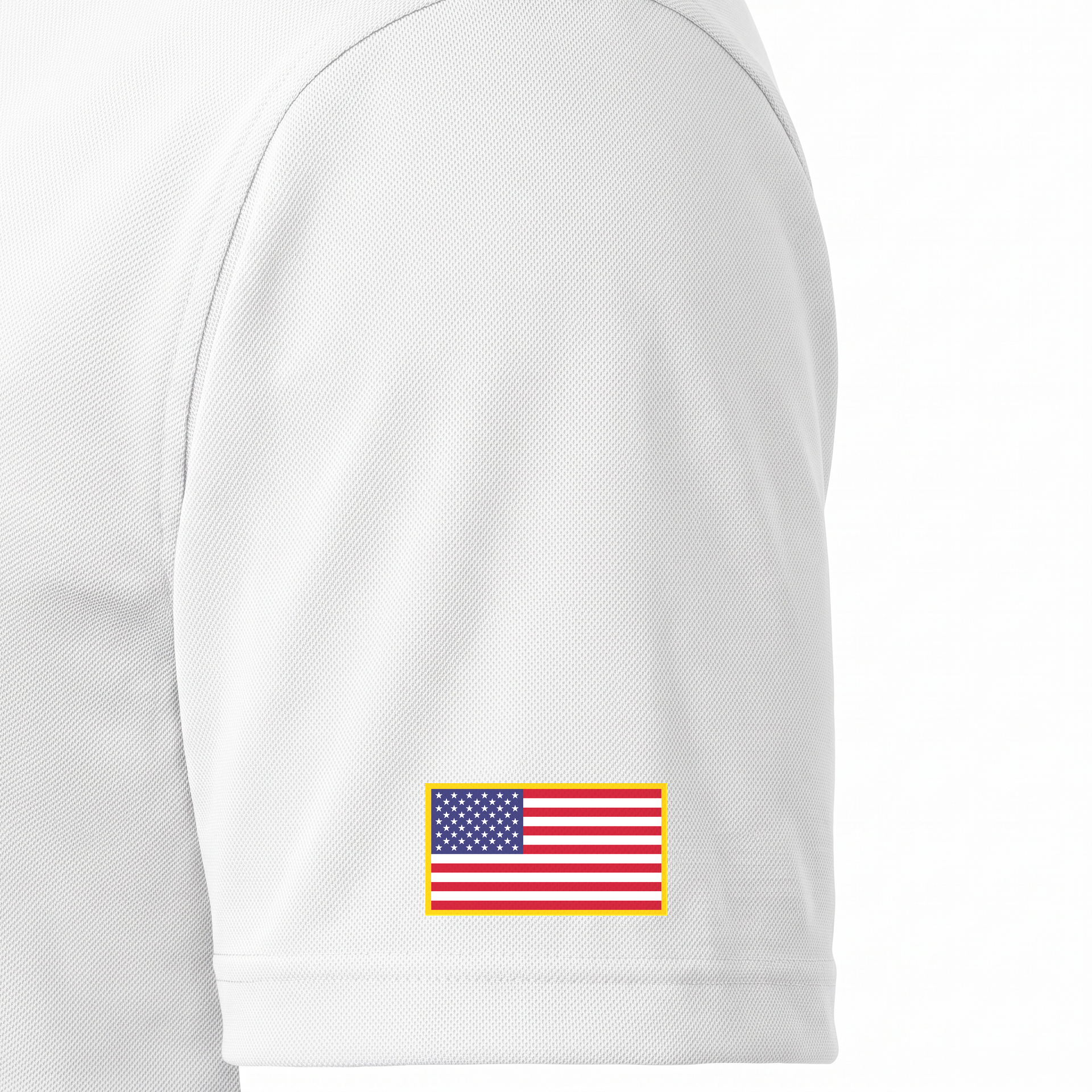 Siskiyou Trojans men's Sport-Tek polo in white, close-up of the left sleeve showing the United States flag patch just above the sleeve hem
